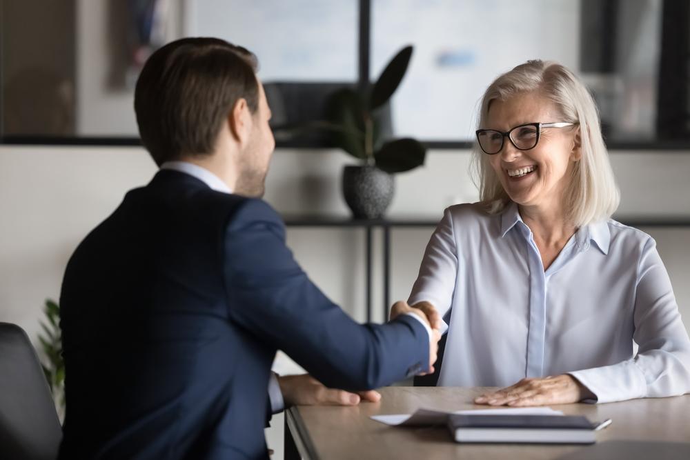 A man and a woman shaking hands